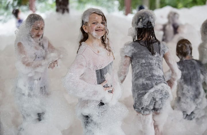 children playing in bubbles