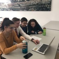 Group of students video-chatting with their Arab and Israeli peers.