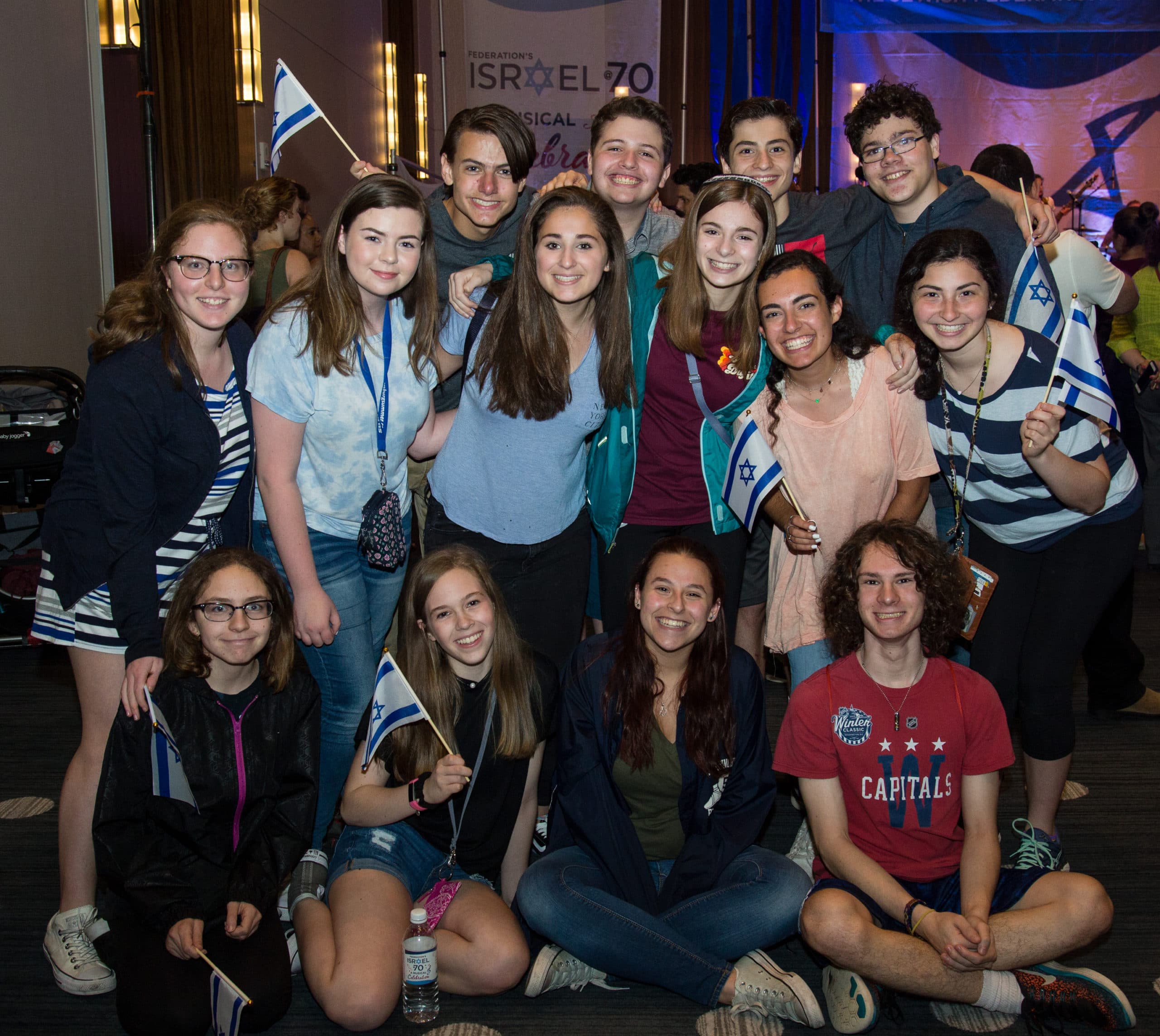 teens posing with Israeli flags