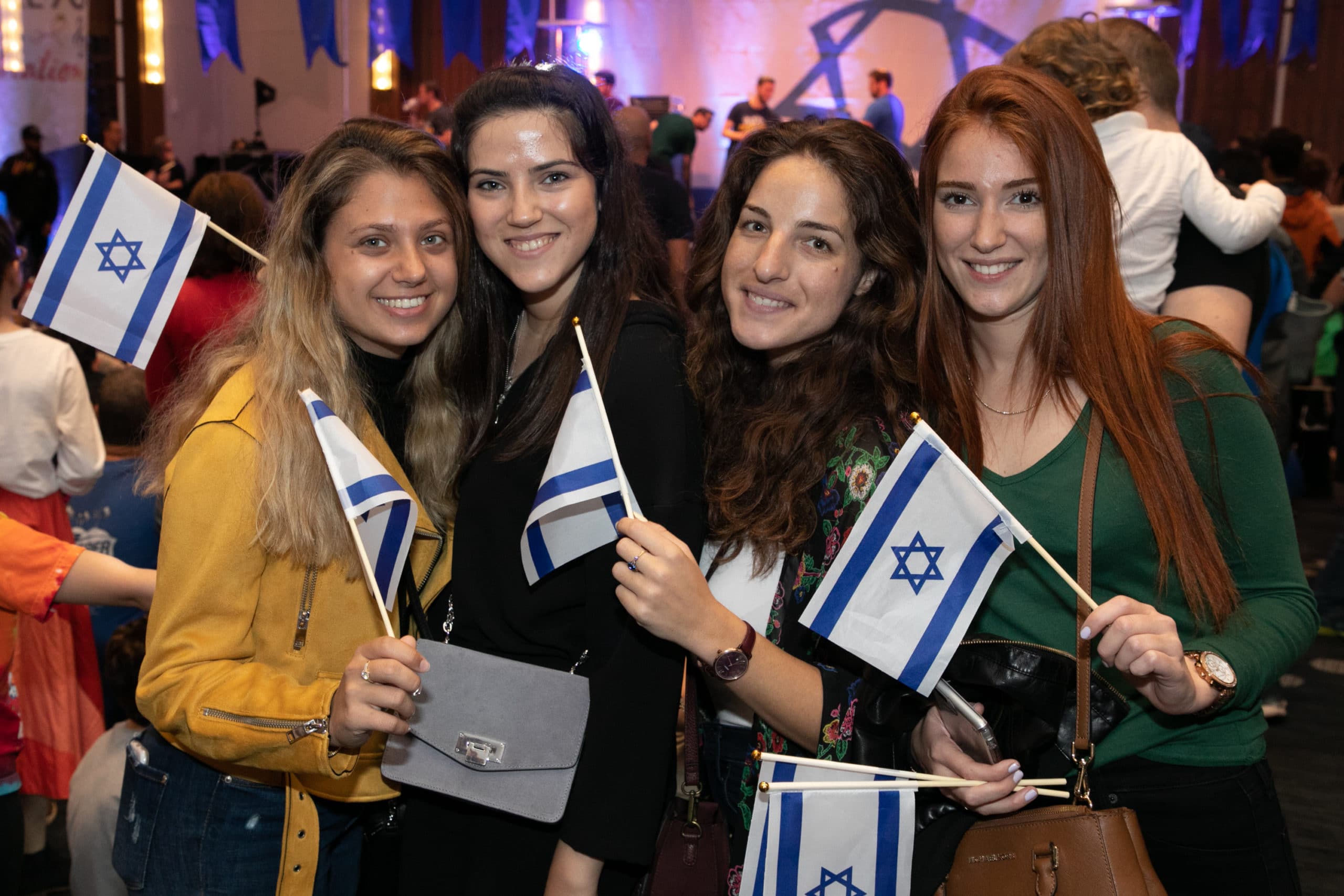4 young women with Israeli flags