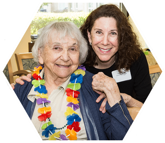 volunteer posing with elderly woman
