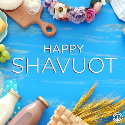 Happy Shavuot with dairy and grain on light blue table