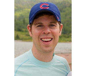 Josh Brown 300x267 Josh Brown outside wearing baseball cap.