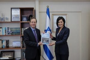 Incoming Jewish Agency shlicha Gadeer Kamal-Mreeh with outgoing Chairman of The Jewish Agency and Israels President-elect Isaac Herzog 1