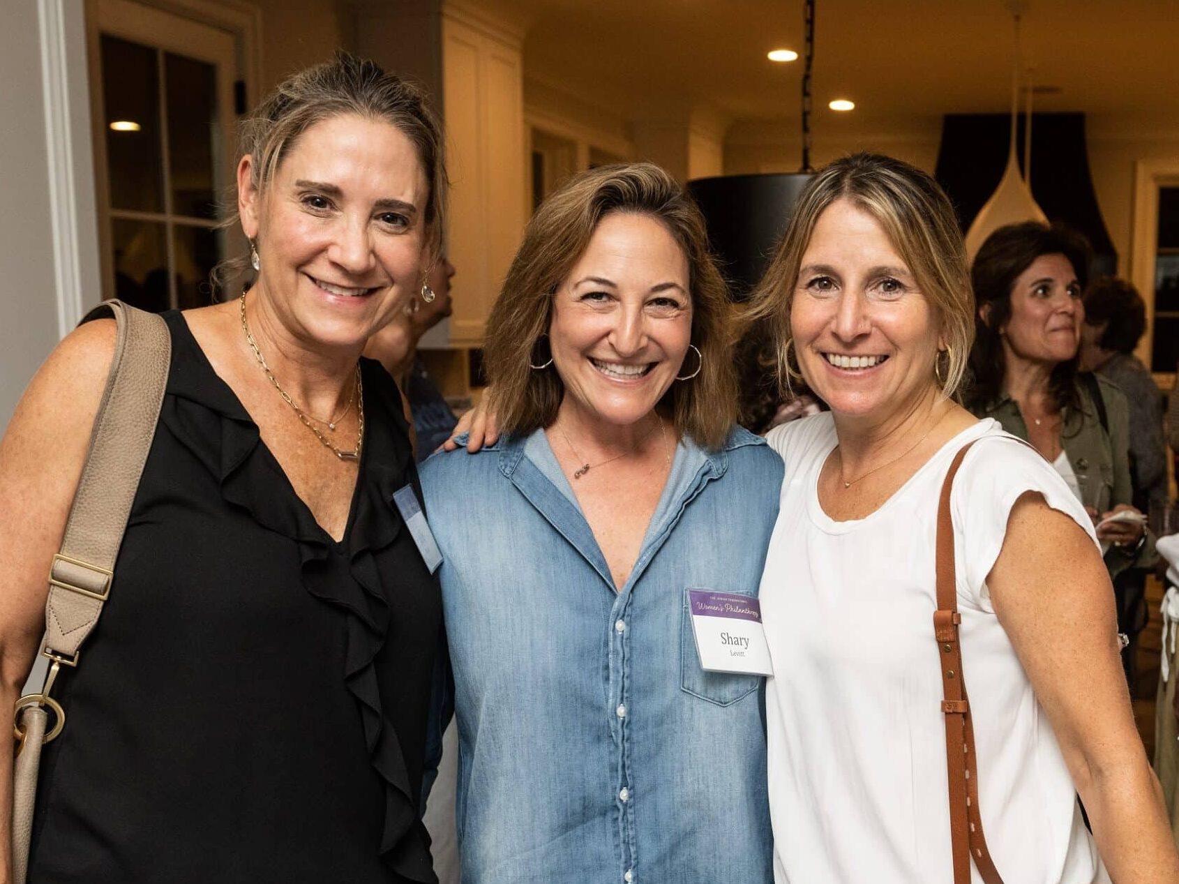Photo of three women at Federation event