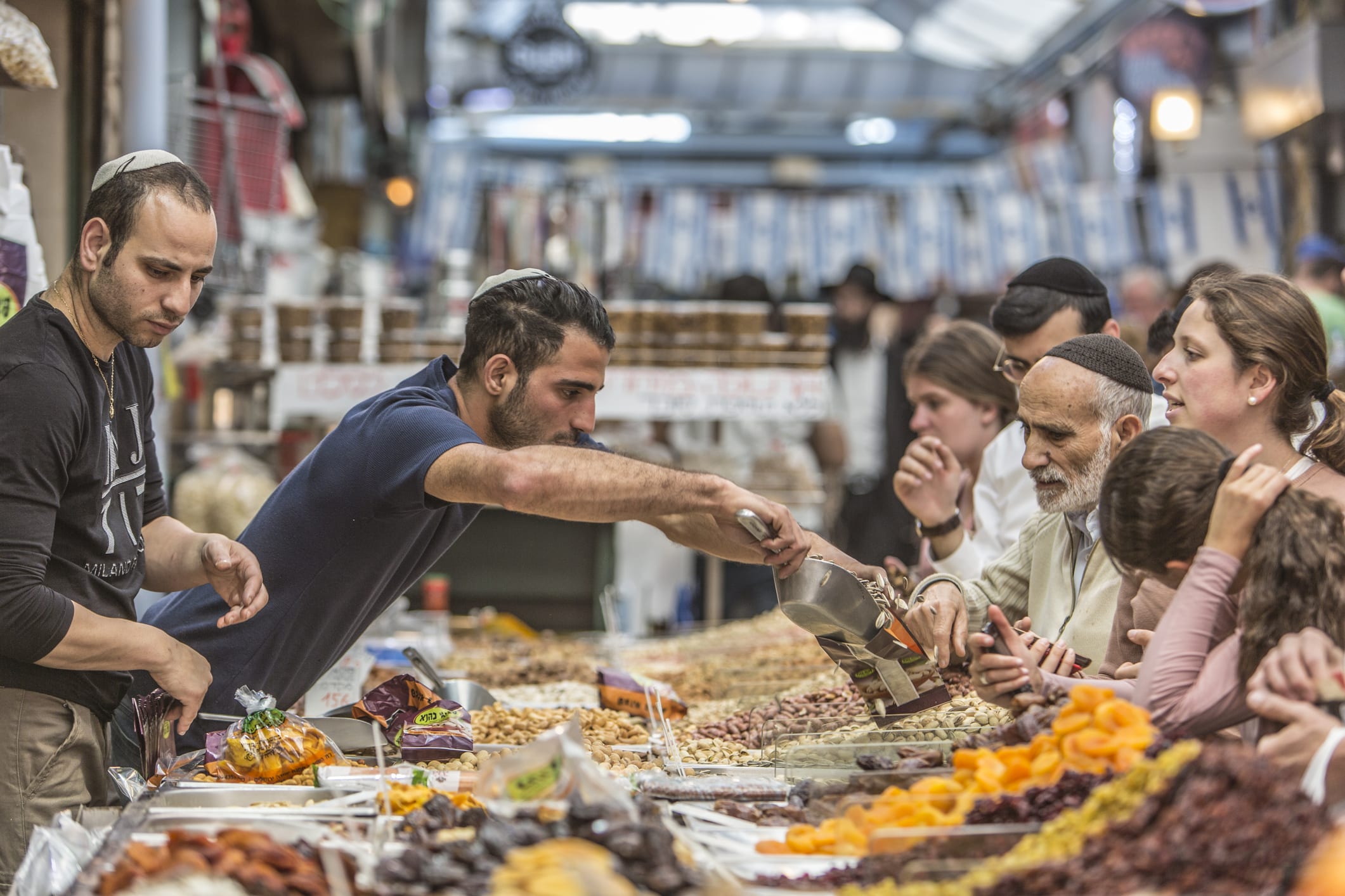People in Jerusalem buying seeds and dried foods