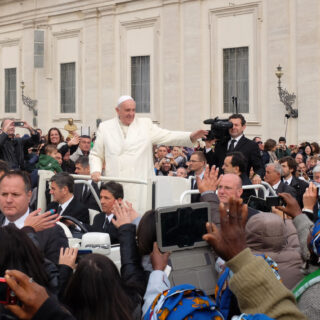 Vatican  City - October 29, 2014: Pope Francis greets attendees at the weekly general audience on October 29, 2014 in Rome. Every week, thousands of pilgrims from around the world take this opportunity to meet the Pontifex.