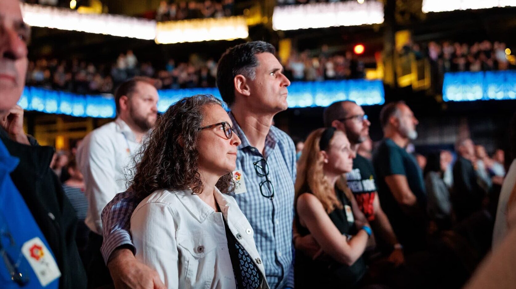 A man and woman stand in the audience of the Anthem building