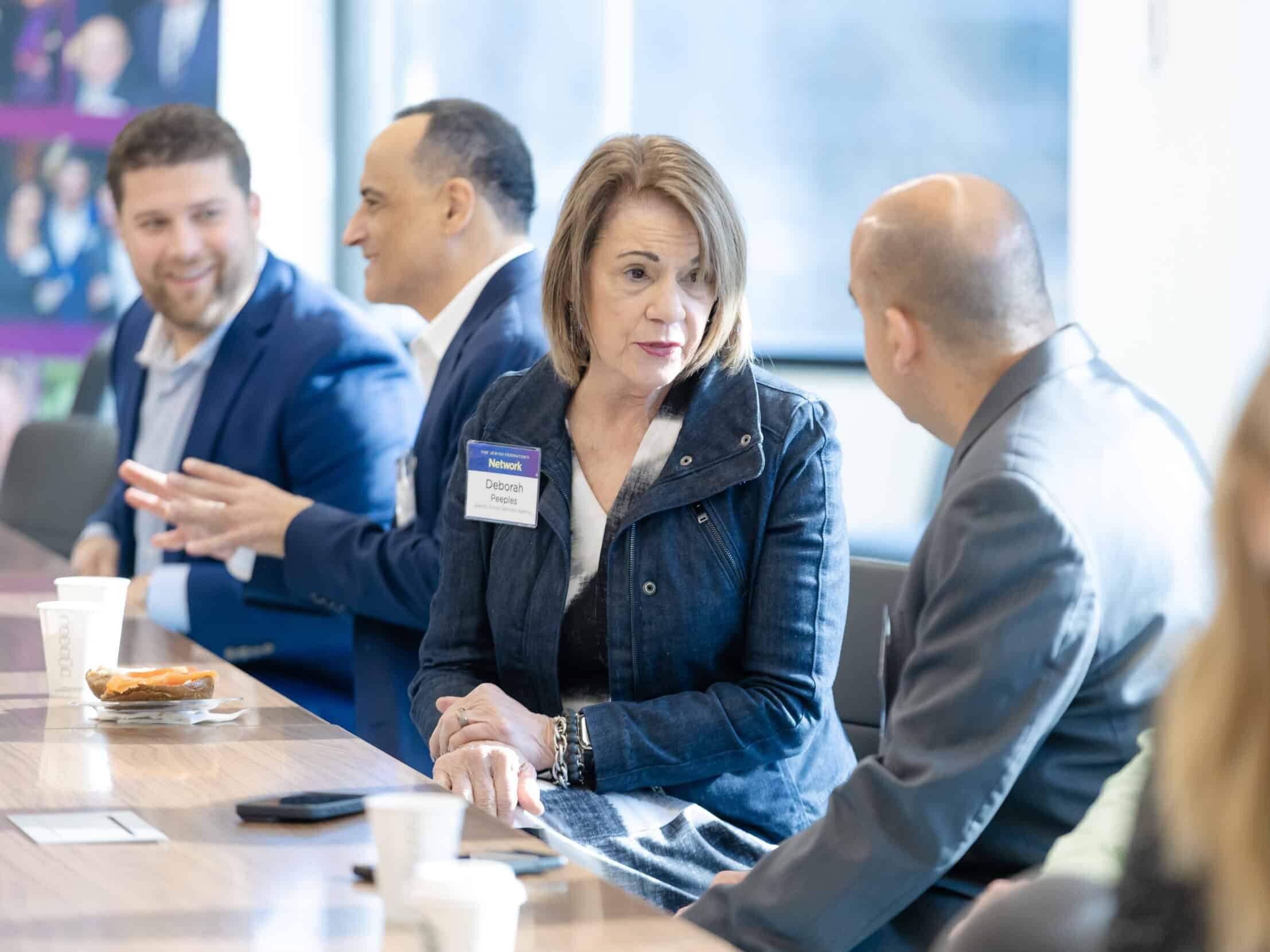 People in conversation at a Network event