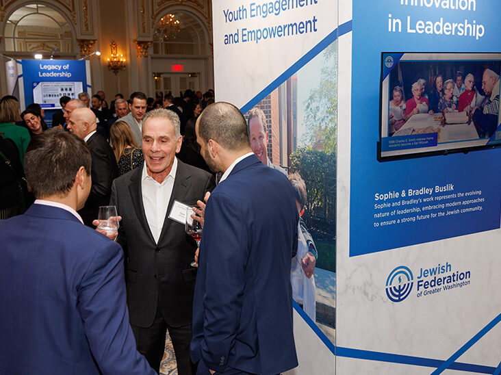 Group of people chatting with each other at Federation's Cornerstone event.