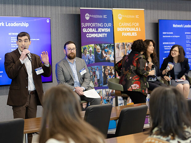 Man speaking into microphone at The Network event in Northern Virginia.
