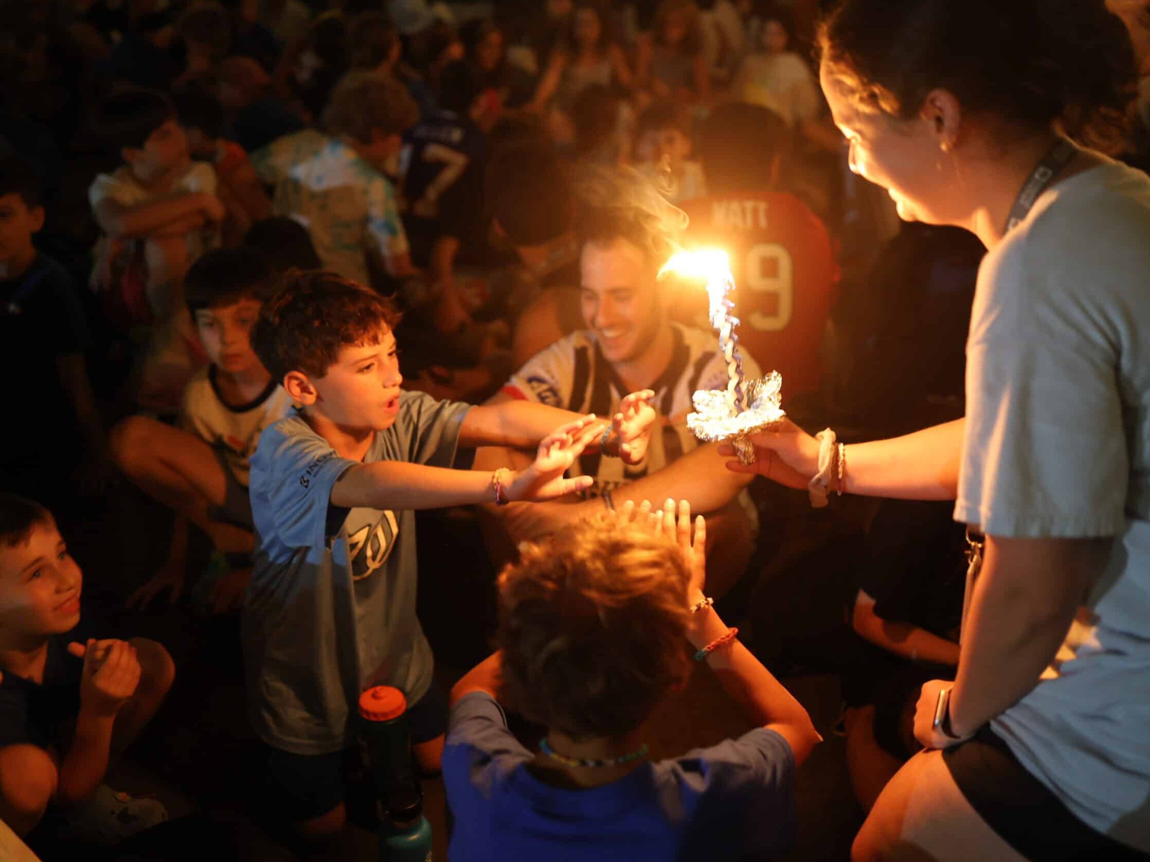 Campers holding Havdalah candle.