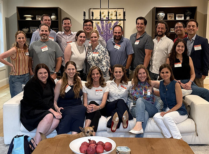 Large group of Next Gen participants smile for a photo.
