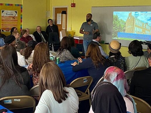 Person speaking to audience about security.